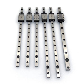 Six DFH 440C stainless MGN linear rails with carriages for Salad Fork 160mm laid out on a white background